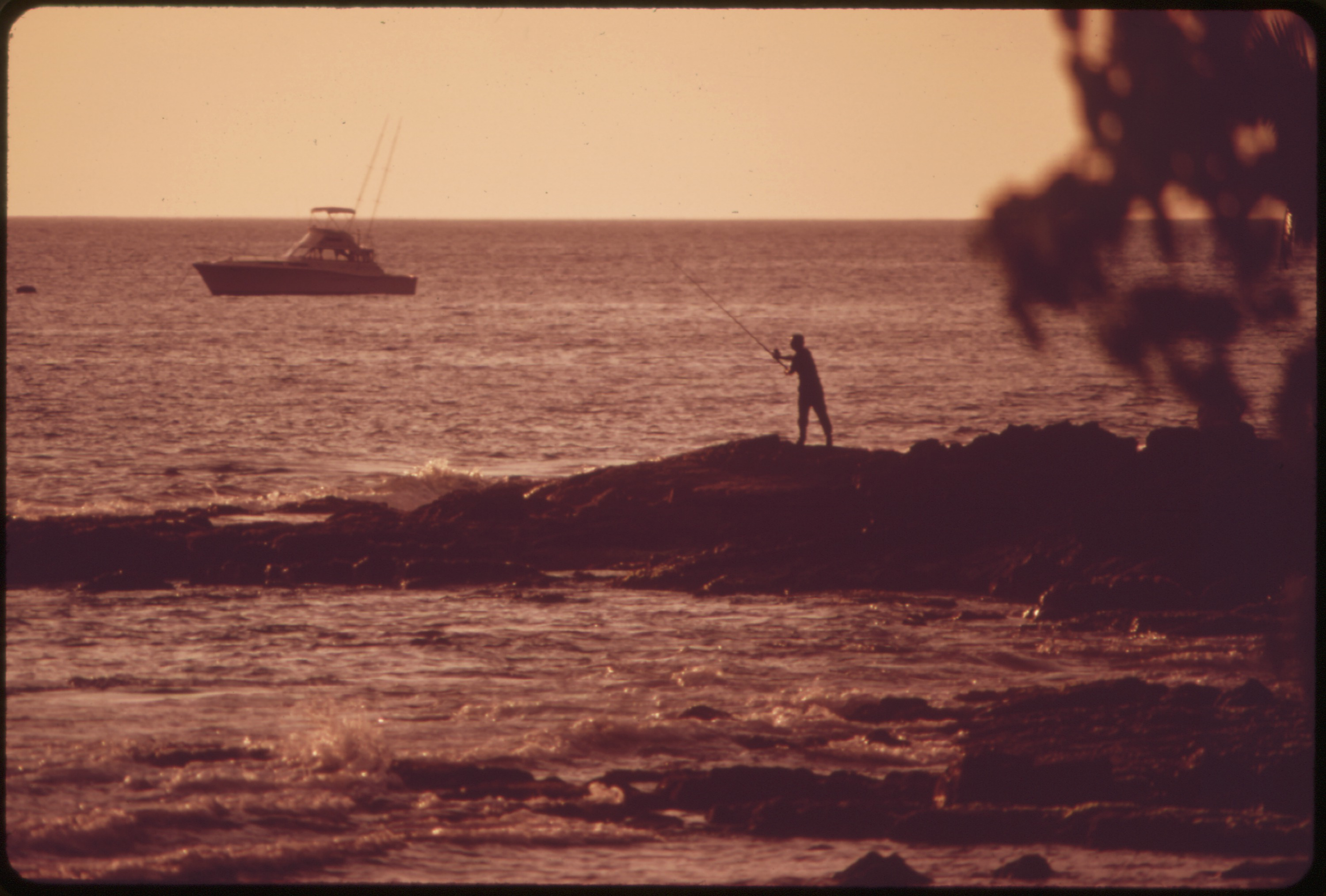 A boat off the Kona coast on Hawaiʻi Island, used for charter and visitor safety coverage.
